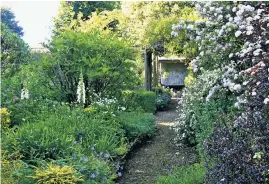  ??  ?? QUIET CORNER
The old walled garden, above, where Alasdair Forbes indulges his love of flowers; left, Cyril, a longtime helper at Plaz Metaxu