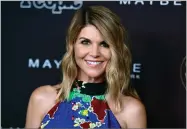  ??  ?? AP FILE PHOTO BY RICHARD SHOTWELL In this 2017 photo, actress Lori Loughlin arrives at the 5th annual People Magazine “Ones To Watch” party in Los Angeles. The FBI says Loughlin has been taken into custody in connection with a scheme in which wealthy parents paid bribes to get their children into top colleges.