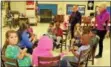  ?? MICHILEA PATTERSON — DIGITAL FIRST MEDIA ?? About 10 children sit down to learn how to play the recorder during a free music program at the Christ Episcopal Church.