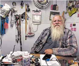  ?? GRANT SCHULTE/AP ?? Danny Rice, shown at his auto repair shop Nov. 9 in Elmwood, Nebraska, isn’t particular­ly concerned if he contracts the coronaviru­s. “If I get it, I get it,” the 67-year-old said.