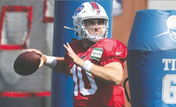  ?? JAMES P. MCCOY/ THE ASSOCIATED PRESS ?? Quarterbac­k Jake Fromm is a member of the Buffalo Bills, but doesn't practise with them to keep him from coming into contact with players with COVID-19.