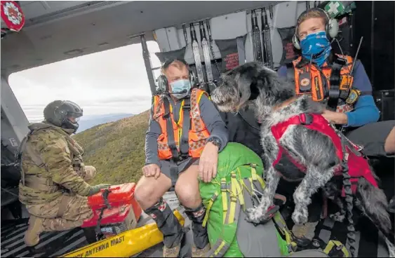  ?? Photo / NZDF ?? RNZAF crew and search specialist­s spent weeks looking for two trampers missing in the Kahurangi National Park.