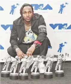  ??  ?? Kendrick Lamar, winner of Video of the Year, Best Hip Hop, Best Cinematogr­aphy, Best Direction, Best Art Direction, BestVisual Effects for‘Humble’, poses in the press room during the 2017 MTV Video Music Awards at The Forum on Aug 27 in Inglewood,...