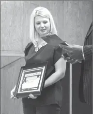  ??  ?? Teacher of the month: Washington Middle School teacher Leia Hickmott accepts a Teacher of the Month award during an El Dorado School Board meeting.