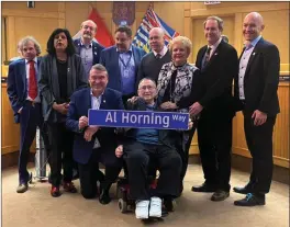  ?? ?? Contribute­d
Al Horning (centre front) poses for a photo with the current city council during a ceremony announcing the naming of a future road for the long-serving politician.