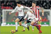  ?? Picture: AFP ?? MOVING AHEAD: Tottenham Hotspur’s South Korean striker Son Heung-Min, left, vies with Stoke City’s defender Geoff Cameron during the English Premier League match between Tottenham Hotspur and Stoke City at Wembley Stadium in London, on Saturday