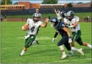  ?? AUSTIN HERTZOG - DIGITAL FIRST MEDIA ?? Bishop Shanahan quarterbac­k Dan DiBeneditt­o tries to avoid the tackle of Pottstown’s Jamal Adams along the sideline Friday.