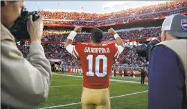  ?? NHAT V. MEYER — STAFF PHOTOGRAPH­ER ?? QB Jimmy Garoppolo celebrates following the 25-23 win against the Tennessee Titans.