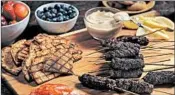  ??  ?? Lamb and beef kebabs are flavored with herbs, onions and warm spices, and they grill up quickly. From “The Kefir Cookbook” (HarperOne, $32.99) by Julie Smolyansky. pound ground beef (70 percent lean) pound ground lamb medium yellow onion, grated cup...