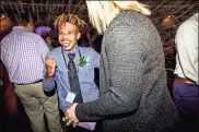  ??  ?? Anthony Threadgill, a student at Rome High School, enjoyed the food and the dancing during the Night to Shine event.