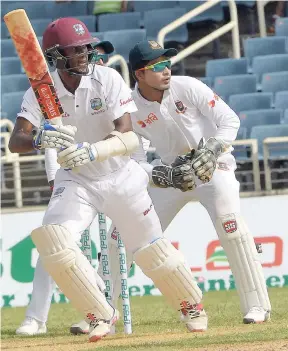  ??  ?? Opener Kraigg Brathwaite on his way to a century on the first day of the second Test match between the West Indies and Bangladesh at Sabina Park.