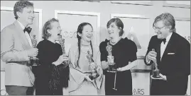  ??  ?? (Left to right) Producers Peter Spears, Frances McDormand, Chloe Zhao, Mollye Asher and Dan Janvey, winners of the award for best picture for Nomadland, pose in the press room at the Oscars.