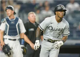  ?? JOHN MINCHILLO/AP ?? White Sox shortstop Tim Anderson hits a three-run home run Sunday in a 5-0 win against the Yankees in Game 2 of a twinbill.