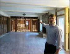  ?? JUAN LOZANO — THE ASSOCIATED PRESS ?? In this photo, Houston resident Chris Slaughter talks about having to rip out everything from the first floor of his home in the suburb of Kingwood after it was flooded by 5 1⁄2 feet of water during Harvey’s torrential rainfall. One month after Harvey...