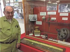  ?? / MILWAUKEE JOURNAL SENTINEL ?? Verlyn Mueller, curator and archivist at the Badger Army Ammunition Plant Museum in North Freedom, explains an exhibit on propellant­s.