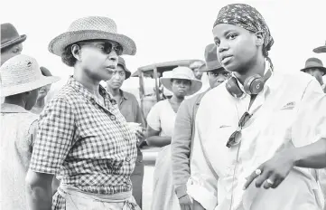  ?? — Courtesy of Netflix ?? Blige and Rees (right) on the set of ‘Mudbound’.