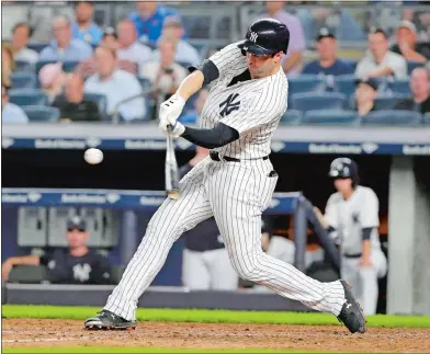  ?? FRANK FRANKLIN II/AP PHOTO ?? Neil Walker of the New York Yankees hits a three-run home run during the seventh inning of Tuesday night’s game against the Boston Red Sox at Yankee Stadium in New York. The Yankees won 3-2.