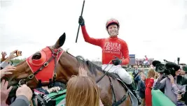  ??  ?? Sydney: Jockey Kerrin McEvoy celebrates on Redzel after they won the Everest 2017 horse race, the world richest turf race at Royal Randwick race course in Sydney on October 14, 2017.