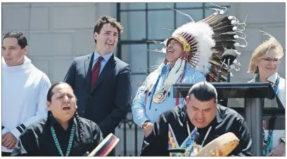  ?? CP PHOTO ?? Prime Minister Justin Trudeau and Perry Bellegarde, national chief of the Assembly of First Nations, celebrate National Indigenous Peoples Day in Ottawa on Wednesday.