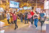  ?? Cory Rubin/The Signal ?? Nicole Gil leads a salsa class at Bunker Hill Bar and Grill at the Westfield Valencia Town Center on Sunday.