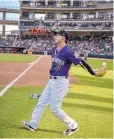  ?? ROBERTO E. ROSALES/JOURNAL ?? Albuquerqu­e’s Daniel Castro catches a ball he flipped over his back while warming up before Friday’s game against Las Vegas.