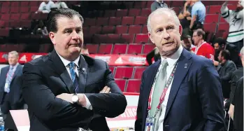  ?? BRUCE BENNETT/GETTY IMAGES ?? Canucks GM Jim Benning, chatting with Dallas GM Jim Nill, is now running the team’s hockey operations because he believes the rebuild won’t require another four years, writes Ed Willes.