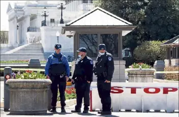  ?? Saul loeb / Getty images ?? members of the u.s. Capitol police pause saturday to pay their respects at the location where fellow officer William evans was killed in an attack in Washington on Friday.