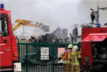  ?? AFP ?? Firefighte­rs at Baumgarten, near Vienna, clear up after Tuesday’s lethal explosion