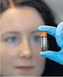  ??  ?? Jess O’hara, a research technician at Imperial College London, tests whether antibodies bind to the virus.