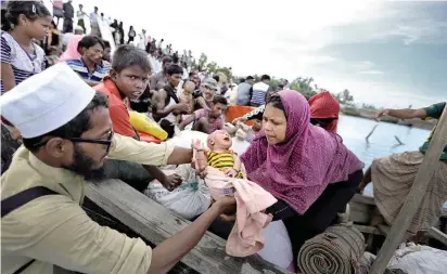  ?? FOTO REUTERS ?? 655.000 refugiados rohinyás han llegado a Bangladesh desde Birmania, lo que acentúa la crisis humanitari­a que padece esta comunidad musulmana.