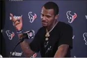  ?? MARK J. TERRILL — THE ASSOCIATED PRESS, FILE ?? Former Texans quarterbac­k Deshaun Watson speaks during a 2019news conference after a game against the Chargers in Carson. The NFL on Tuesday insisted on an indefinite suspension for Watson, who last week agreed to settle 20 of 24 civil lawsuits for sexual misconduct against him.