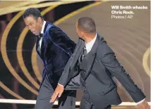  ?? ?? Will Smith whacks Chris Rock. Photos / AP