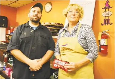  ?? Cassandra Day / Hearst Connecticu­t Media ?? St. Vincent de Paul Middletown Dining Services Manager Lisa MageeCorvo, right, saved a woman’s life Thursday, less than 24 hours after undergoing CPR and Narcan training. She was assisted by head chef Jeremiah Rufini, left.