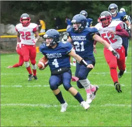  ?? File photo ?? Burrillvil­le senior quarterbac­k Jake Gelinas (4) threw four touchdown passes and ran for a score in the Broncos’ 55-14 Division II quarterfin­al win over Rogers.