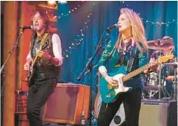  ??  ?? Meryl Streep picks and sings in Ricki and the Flash alongside ’80s rock idol Rick Springfiel­d, left.