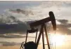  ?? — Reuters ?? An oil pump is seen at sunset outside Vaudoy-en-brie, near Paris, France.