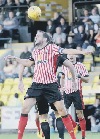  ??  ?? John O’Shea wins a header for Sunderland.