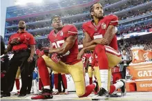  ?? Marcio Jose Sanchez / Associated Press ?? As 49ers, safety Eric Reid and quarterbac­k Colin Kaepernick, right, kneel during the national anthem before a 2016 game.