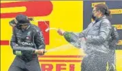  ?? GETTY IMAGES ?? ■
Lewis Hamilton (left) celebrates on the podium after winning the Styrian Grand Prix in Spielberg, Austria, on Sunday.