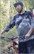  ?? The Maui News KEHAULANI CERIZO photo ?? Aaron “Moose” Reichert wants to highlight the positive volunteer work that mountain bikers at Kahakapao Recreation­al Area have done over the years to protect the area.