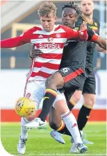  ??  ?? David Templeton is challenged by Partick Thistle’s Abdul Osman