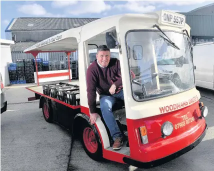  ?? Rob Browne ?? > Milkman Mark Woodman, of Cardiff, has renovated a 45-year-old milk float to help keep up with demand for milk deliveries after UK government plans emerged to cut plastic waste