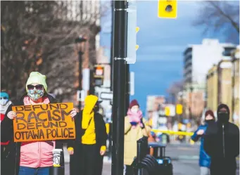  ?? ASHLEY FRASER ?? Demonstrat­ors for Indigenous and Black rights rallied outside Ottawa police headquarte­rs on Nov. 21 after several people were arrested at an earlier protest. Many opposed increasing the police budget.