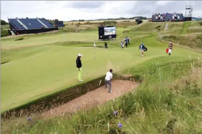  ?? PETER MORRISON, THE ASSOCIATED PRESS ?? Thongchai Jaidee of Thailand plays during practice out of a sand trap on the Par 3, 123-yard eighth hole at the Royal Troon Golf Club on Tuesday.