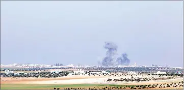  ??  ?? File photo shows smoke billowing following reported airstikres on the village of Um Jalal. — AFP photo