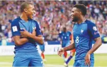  ?? REUTERSPIX ?? Kylian Mbappe celebratin­g a goal with Thomas Lemar.