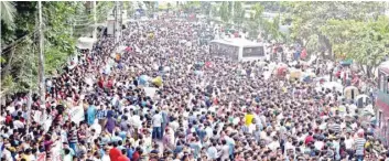 ?? — AFP ?? Thousands of Bangladesh Nationalis­t Party (BNP) supporters stage a protest in Dhaka on Monday, demanding the immediate release of their leader Khaleda Zia, who was jailed early this year for graft.