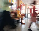  ?? PICTURE: PABALLO THEKISO ?? People walk past the clown character Ronald McDonald at a McDonald’s.