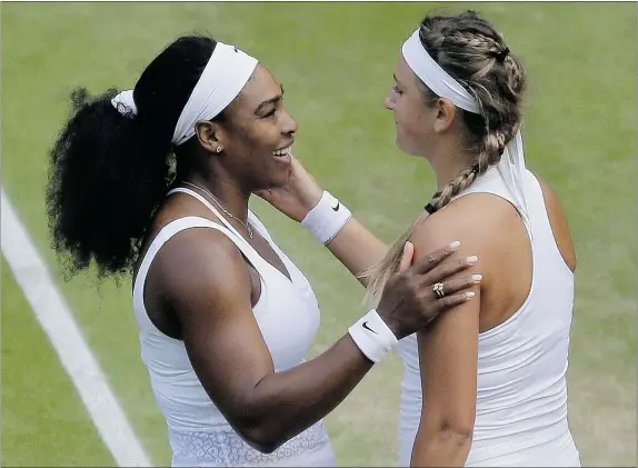  ?? — THE ASSOCIATED PRESS ?? Serena Williams of the United States talks to Victoria Azarenka of Belarus after defeating her in their singles match at the All England Lawn Tennis Championsh­ips in Wimbledon on Tuesday. Williams won 3-6, 6-2, 6-3.
