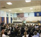  ?? BEN LAMBERT - THE REGISTER CITIZEN ?? Father Chris Gaffrey, OFM, had his beard shaved in front of a boisterous group of St. Anthony school students Thursday afternoon to celebrate the students’ fundraisin­g effort in their annual walk-a-thon event.